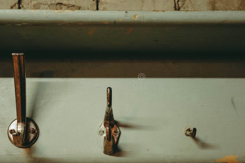 Coat hooks on bricks wall stock photo. Image of abstract 142322036