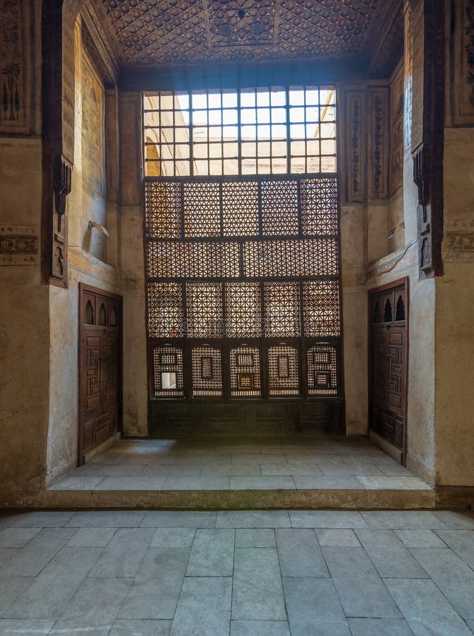 Interleaved wooden window Mashrabiya, and wooden decorated ceiling at ottoman historic Waseela Hanem House, Old Cairo, Egypt