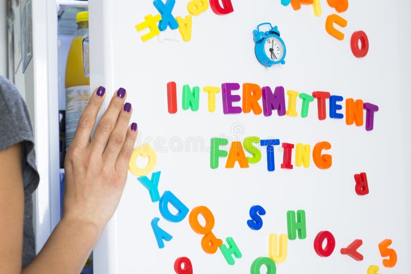 Intermittent fasting lifestyle concept with woman standing in front of fridge starring at food. Intermittent fasting lifestyle concept with woman standing in front of fridge starring at food