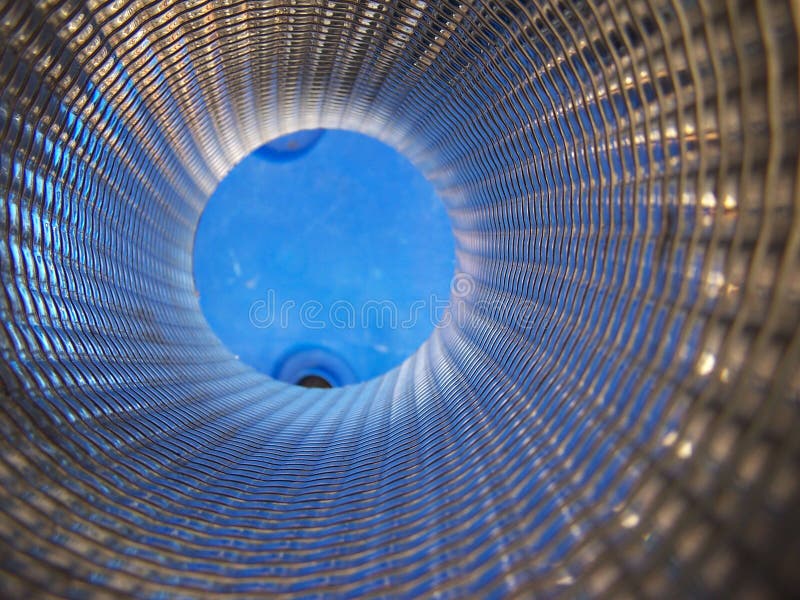 Inside of pipe with blue reflective spiral texture. Inside of pipe with blue reflective spiral texture