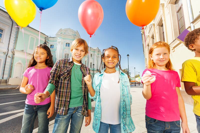 International group of children with balloons stock images International group of children with balloons stock images