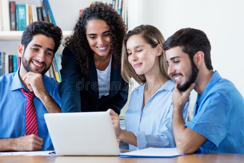 International group of software engineers and programmers at computer stock photos