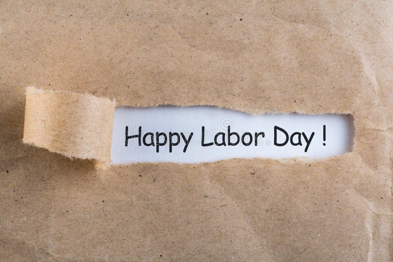 International labor Day at May 1st. Day text on notes in torn envelope. Spring time, labour day - 1 of may, month