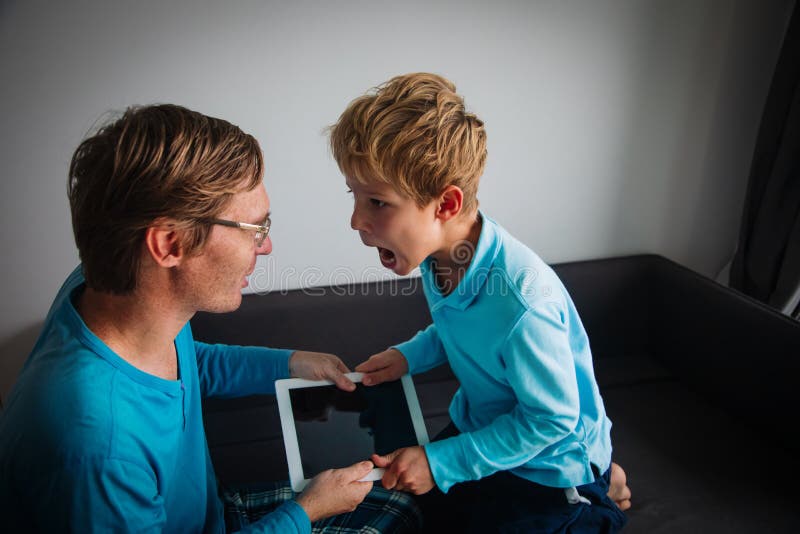 Internet addiction- father taking touch pad from angry child