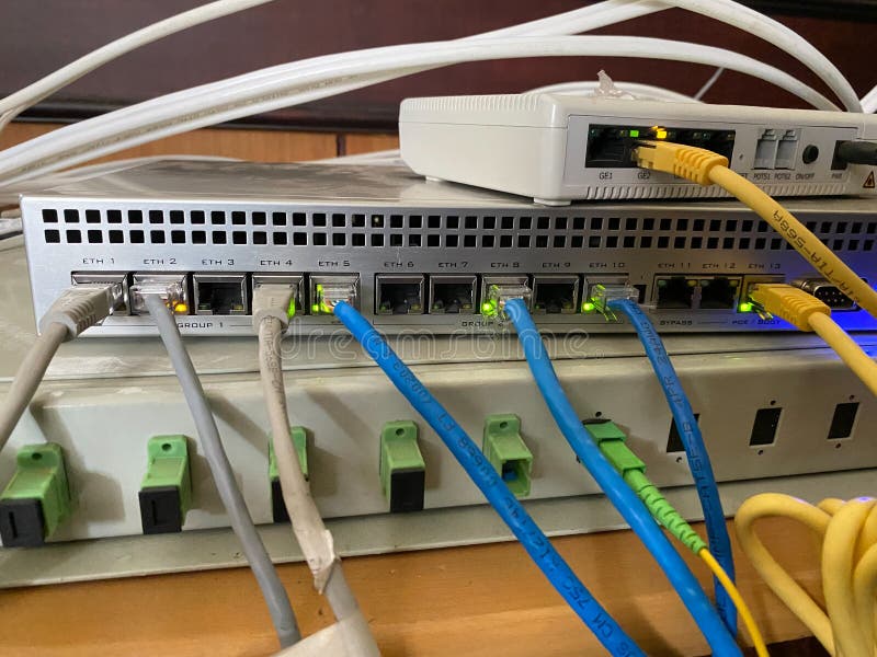 Internet network devices connected to each other via cable. proxy, hub, and router royalty free stock photo