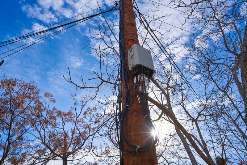Internet optical fiber connection box in a pole stock images
