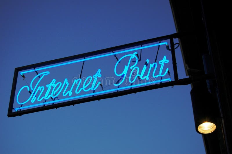 Internet point neon sign at dusk. Internet point neon sign at dusk