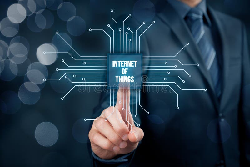 Internet of things IoT concept. Businessman click on Internet of Things button in simplified design of chip, connected with abstract devices represented by points.