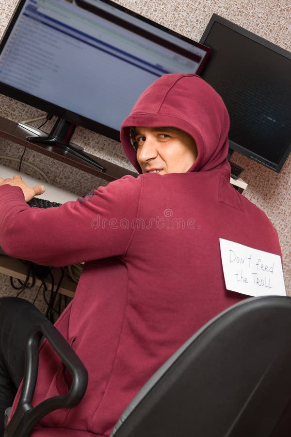 Internet Troll Is Mean At The Computer Stock Photo - Download