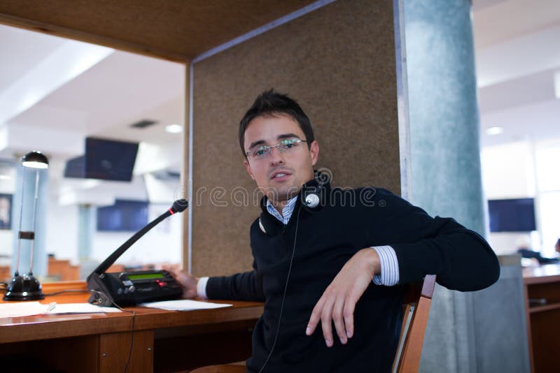 Interpreting - Microphone and switchboard in an simultaneous interpreter booth. Interpreting - Microphone and switchboard in an simultaneous interpreter booth