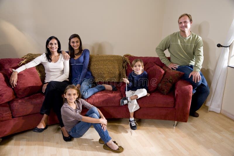 Interracial Family Of Five On Living Room Couch Stock Photo Image