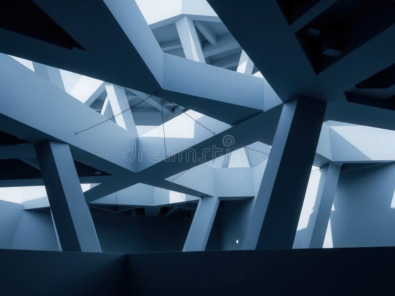 Crisscrossing beams and trusses create cavernous interior with layered pathways and dramatic light, intersecting supports cast. Load structural stock images, royalty-free photos and pictures