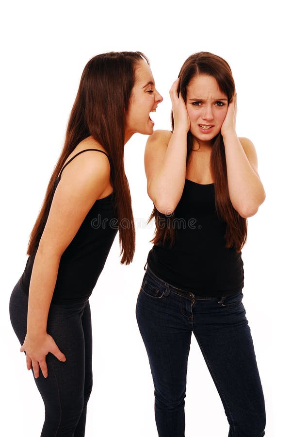 Girl shouting at her friend isolated on white. Girl shouting at her friend isolated on white