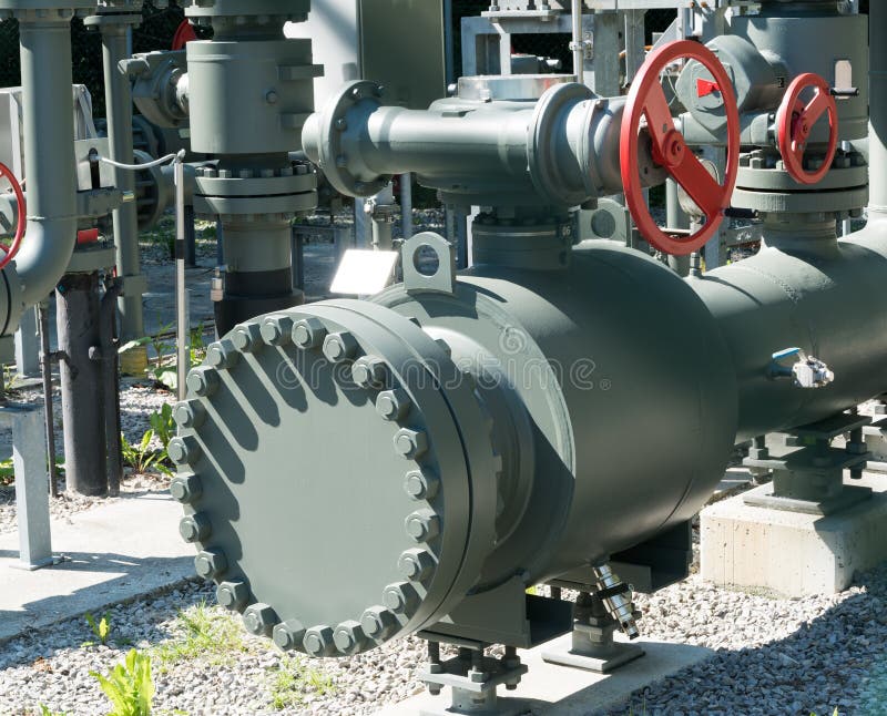 Intricate system of metal pipes and valves and wheels used to regulate water and sewage stock photography
