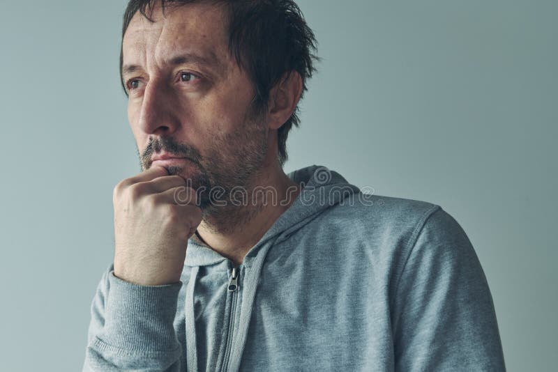 Introspection concept, man thinking an analyzing himself, portrait of thoughtful casual caucasian male person