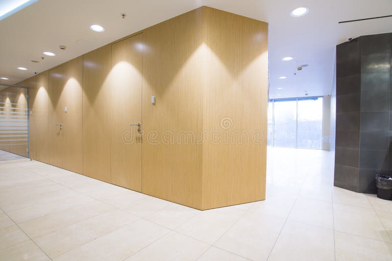 Bright minimalistic office interior with glass, oak wood and much ambient light. Bright minimalistic office interior with glass, oak wood and much ambient light