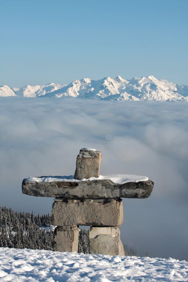 An inukshuk stands guard over Whistler Mountain, British Columbia, Canada.