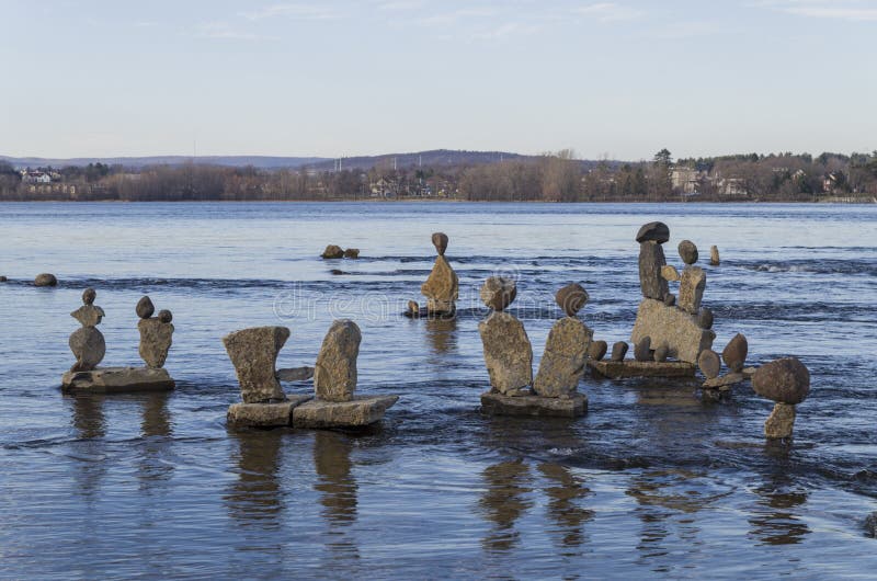 Inukshuks in the Ottawa River at Remics Rapids. Every summer Inukshuks are built along the Ottawa River at Remics Rapids along the Ottawa River Parkway stock photography Inukshuks in the Ottawa River at Remics Rapids. Every summer Inukshuks are built along the Ottawa River at Remics Rapids along the Ottawa River Parkway stock photography