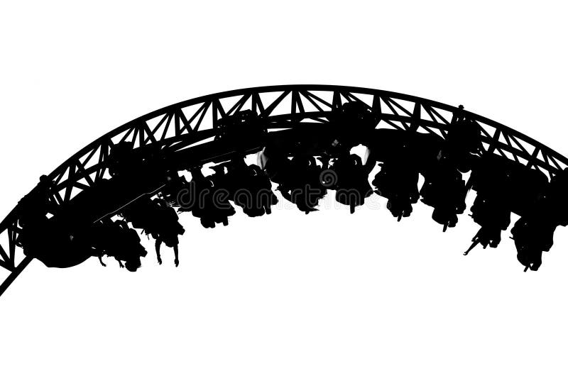 Inverted roller coaster silhouette at amusement park at amusement park.. royalty free stock photography