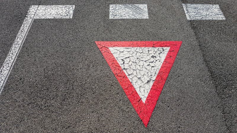 Inverted white with red border triangular road sign yield that you need to wait royalty free stock photography Inverted white with red border triangular road sign yield that you need to wait royalty free stock photography