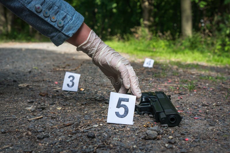 Investigator Collects Evidence - Crime Scene Investigation Stock Photo