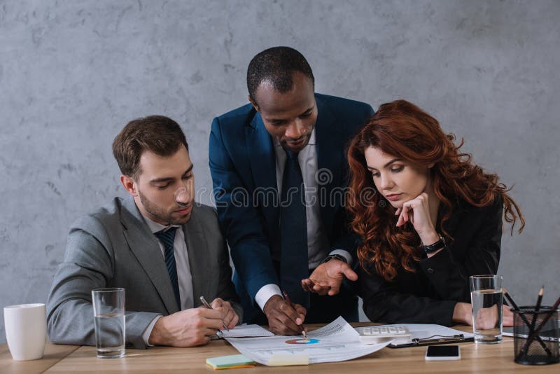 Investment adviser showing presentation to business royalty free stock images Investment adviser showing presentation to business royalty free stock images