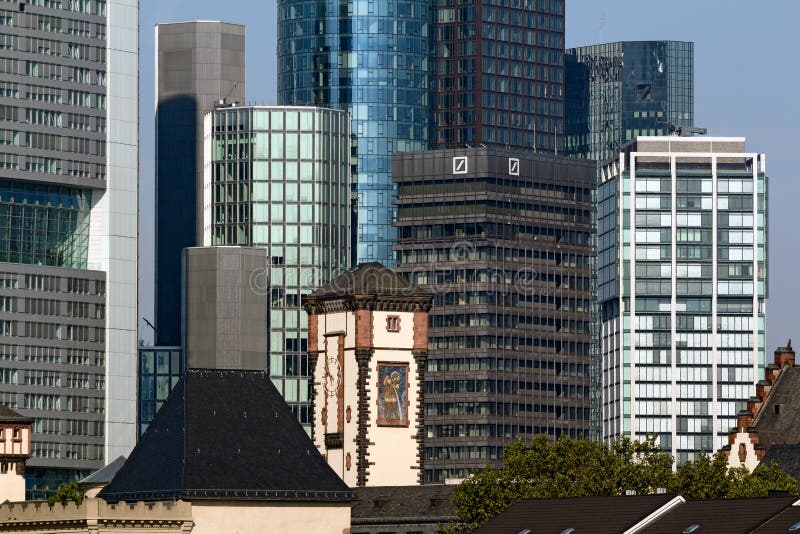 Frankfurt am Main, Germany - August 29, 2013: Skyline with Bank Towers of the Financial District including the black Investment Banking Center (IBC) of Deutsche Bank AG. Frankfurt am Main, Germany - August 29, 2013: Skyline with Bank Towers of the Financial District including the black Investment Banking Center (IBC) of Deutsche Bank AG