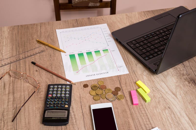 Investment Graphs with Laptop and Calculator Stock Image Image of