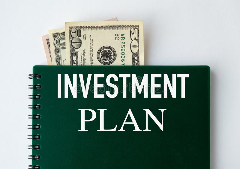 Investment Plan text on the notebook and Dollars. Business concept stock photo