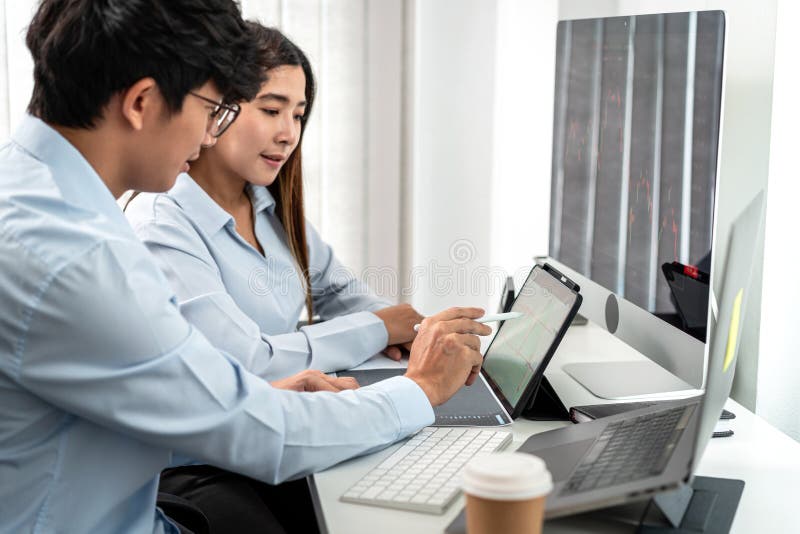 Investor business team working with computer, tablet and analyzing graph stock market trading planning with chart data financial royalty free stock photo