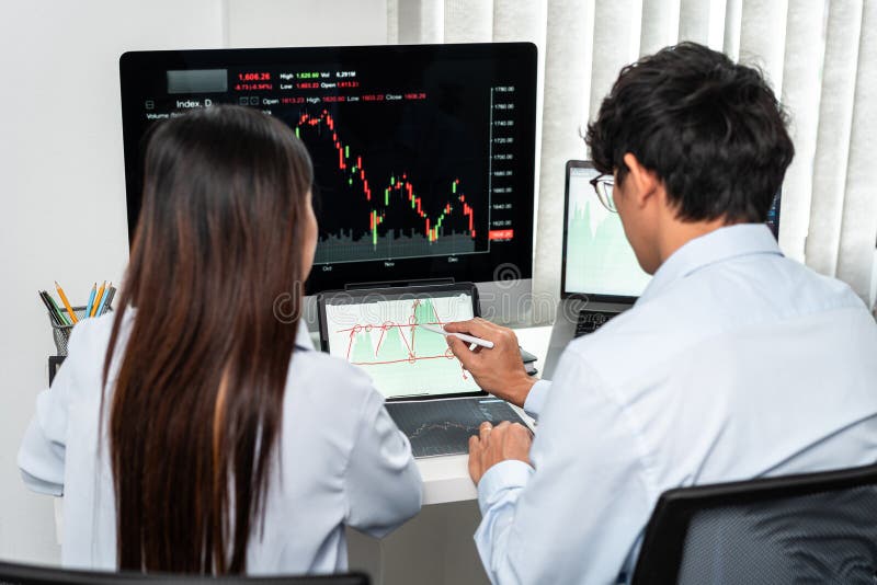 Investor business team working with computer, tablet and analyzing graph stock market trading planning with chart data financial royalty free stock image