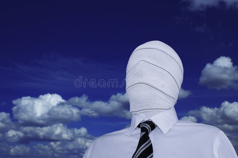 The invisible man. Man wearing a white shirt and a black and white striped tie with his face hidden under a bandage. + clipping path The invisible man. Man wearing a white shirt and a black and white striped tie with his face hidden under a bandage. + clipping path