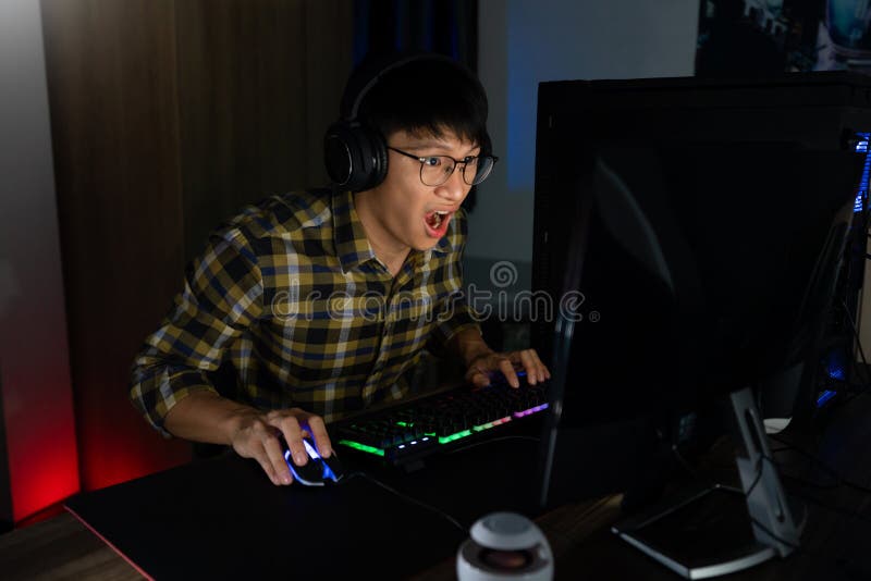 Footage of Young Asian esport woman gamers playing online video games on  the computer with neon light at home. Attractive girl gaming player feels  enjoy technology broadcast live streaming. 25213471 Stock Video