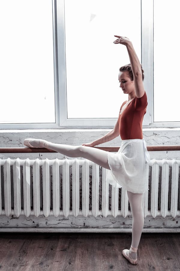 Beautiful young woman focusing on her exercise royalty free stock photo Beautiful young woman focusing on her exercise royalty free stock photo