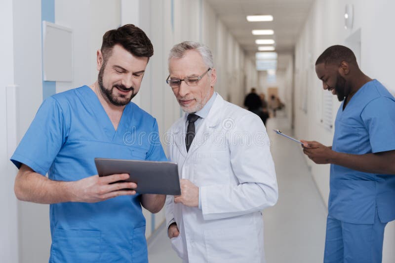 Involved Medics Testing New Gadget in the Hospital Stock Image Image
