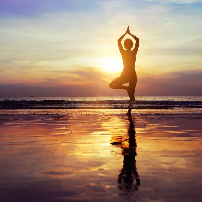 Yoga on the beach, healthy lifestyle concept. Yoga on the beach, healthy lifestyle concept