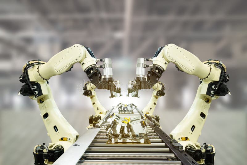 Iot industry 4.0 technology concept.Smart factory using trending automation robotic arms with empty conveyor belt in operation lin. E. Automotive manufacturing Iot industry 4.0 technology concept.Smart factory using trending automation robotic arms with empty conveyor belt in operation lin. E. Automotive manufacturing