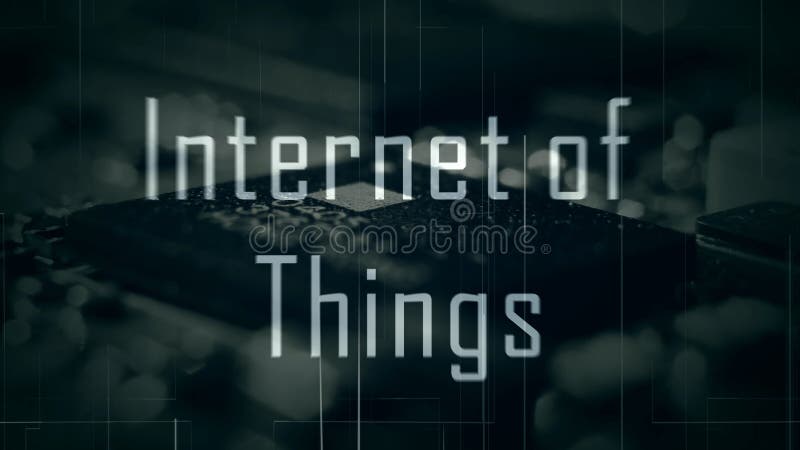 IOT Internet of Things title with a microchip background and a green color grade stock photography
