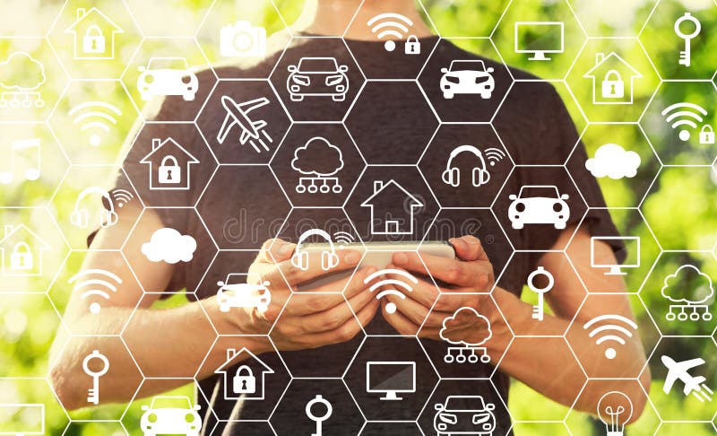 IoT theme with man holding his smartphone stock image IoT theme with man holding his smartphone stock image