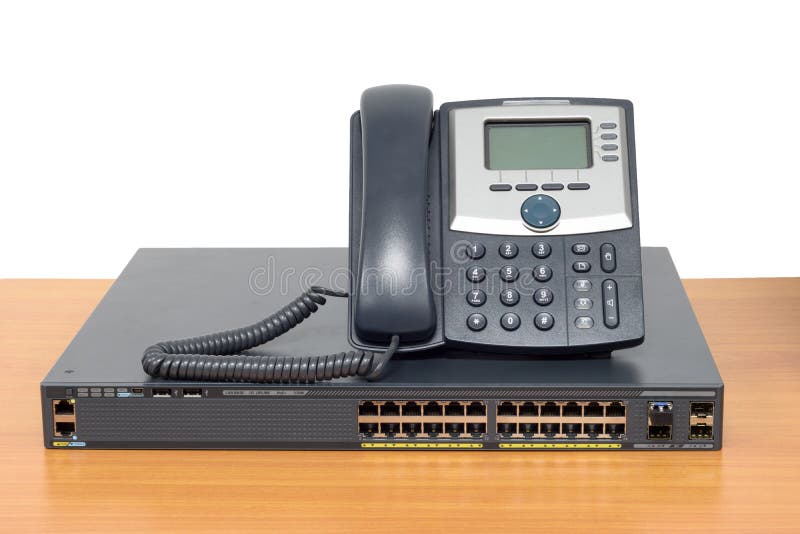 IP phone and networking switch on wood table royalty free stock photography IP phone and networking switch on wood table royalty free stock photography