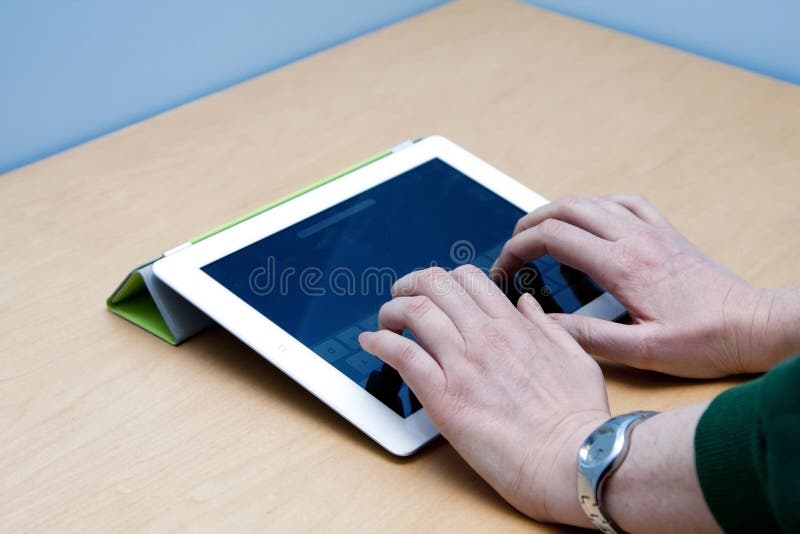 IPad 2 tablet user hands typing royalty free stock image