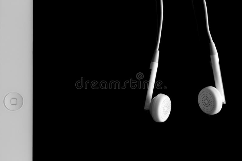IPad and earphones editorial photo. Image of listen, mobile 44565461