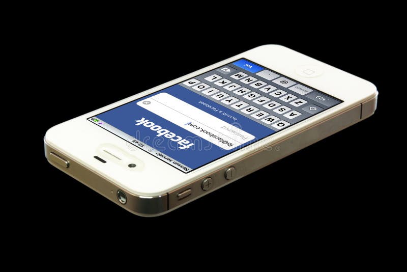 Facebook.com on a iPhone screen, isolated on a black background. Facebook is the largest social media network on the world wide web. Facebook.com on a iPhone screen, isolated on a black background. Facebook is the largest social media network on the world wide web.