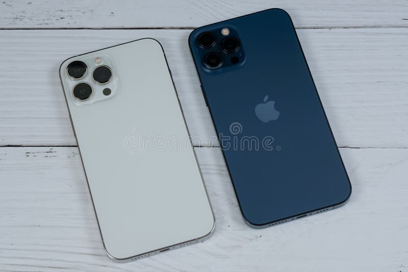 IPhone 13 Pro Max in Silver and IPhone 12 Pro Max in Pacific Blue. Editorial Photo Image of