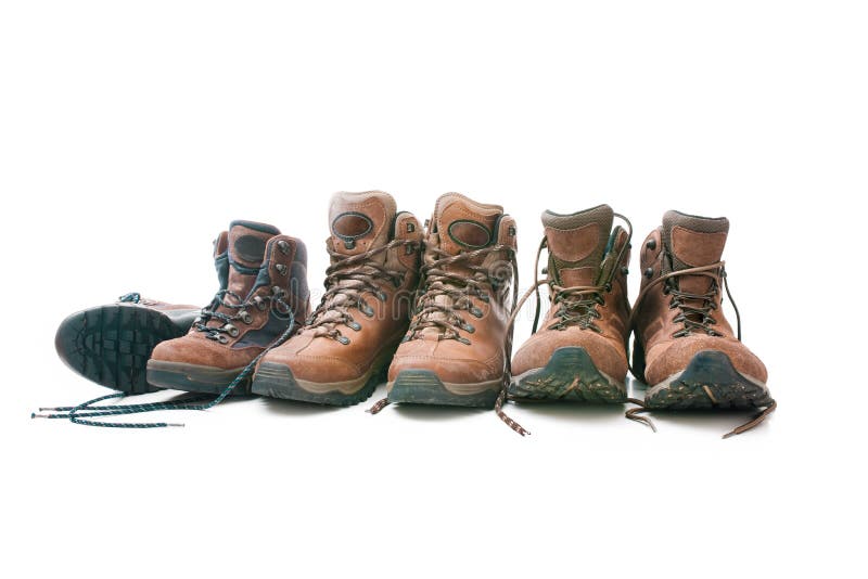 Three pairs of hiking boots. Concept for family hiking. Three pairs of hiking boots. Concept for family hiking
