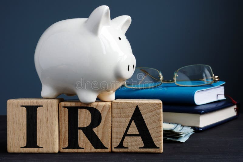 IRA individual retirement account written on wooden cubes. IRA individual retirement account written on wooden cubes