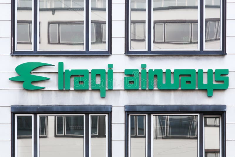 Iraqi Airways-embleem op een muur stock afbeelding Iraqi Airways-embleem op een muur stock afbeelding