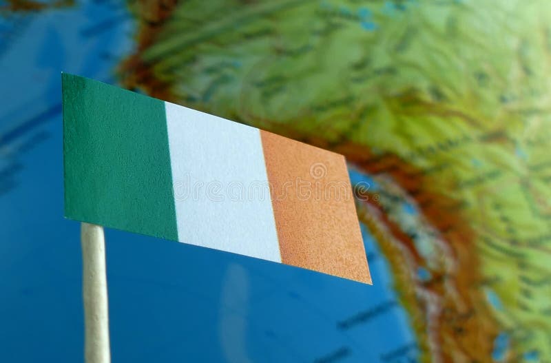 Ireland flag with a globe map as a background macro