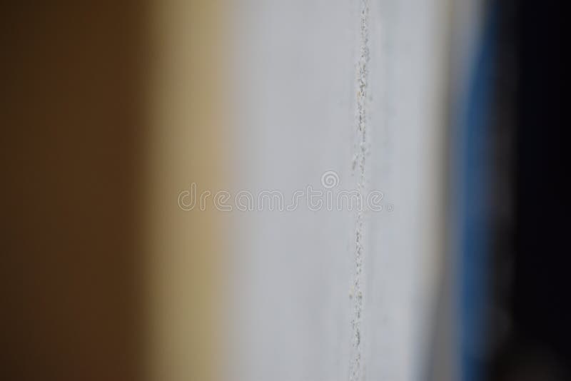 Irgendein mittlerer Fokus auf der Wand zwischen Gelbem und Blauem stockfotos Irgendein mittlerer Fokus auf der Wand zwischen Gelbem und Blauem stockfotos