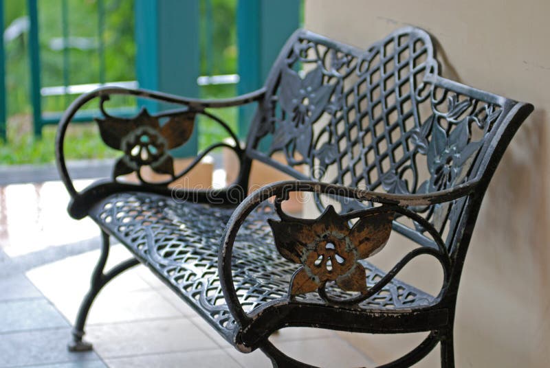 Iron bench at the garden royalty free stock image
